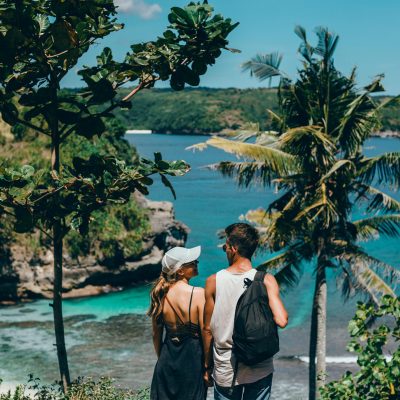 Beautiful young couple posing on the sea and beach love and tenderness